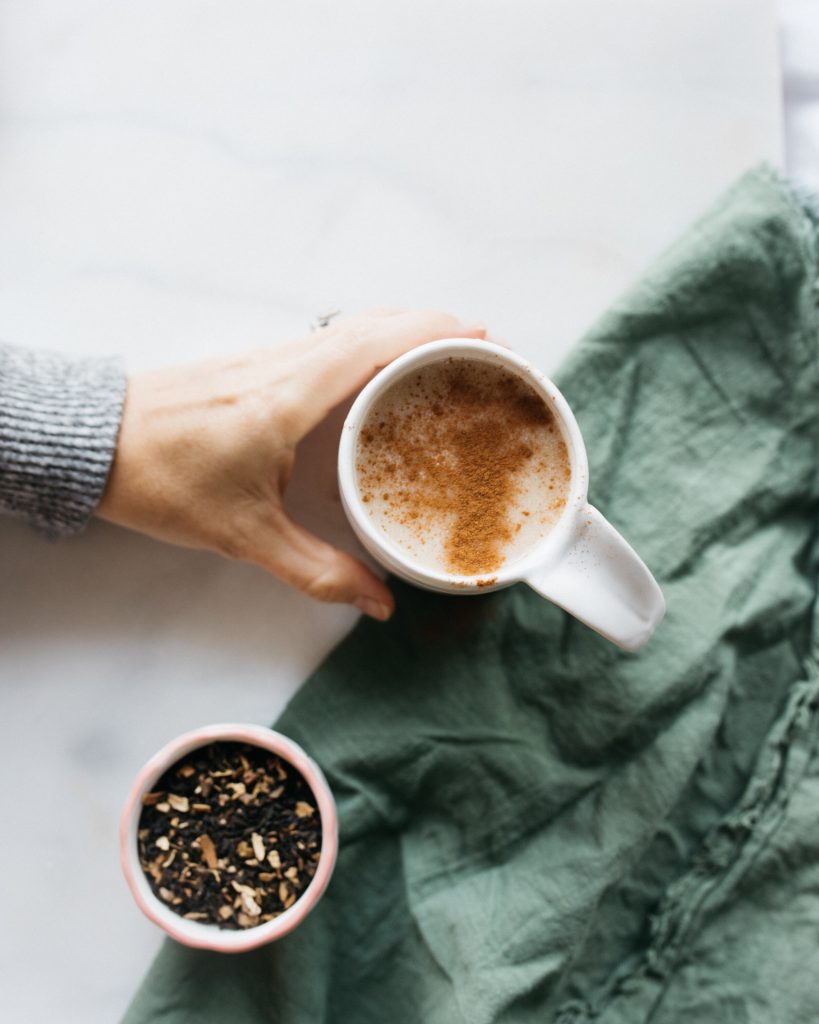 chai latte in white mug with spiced tea