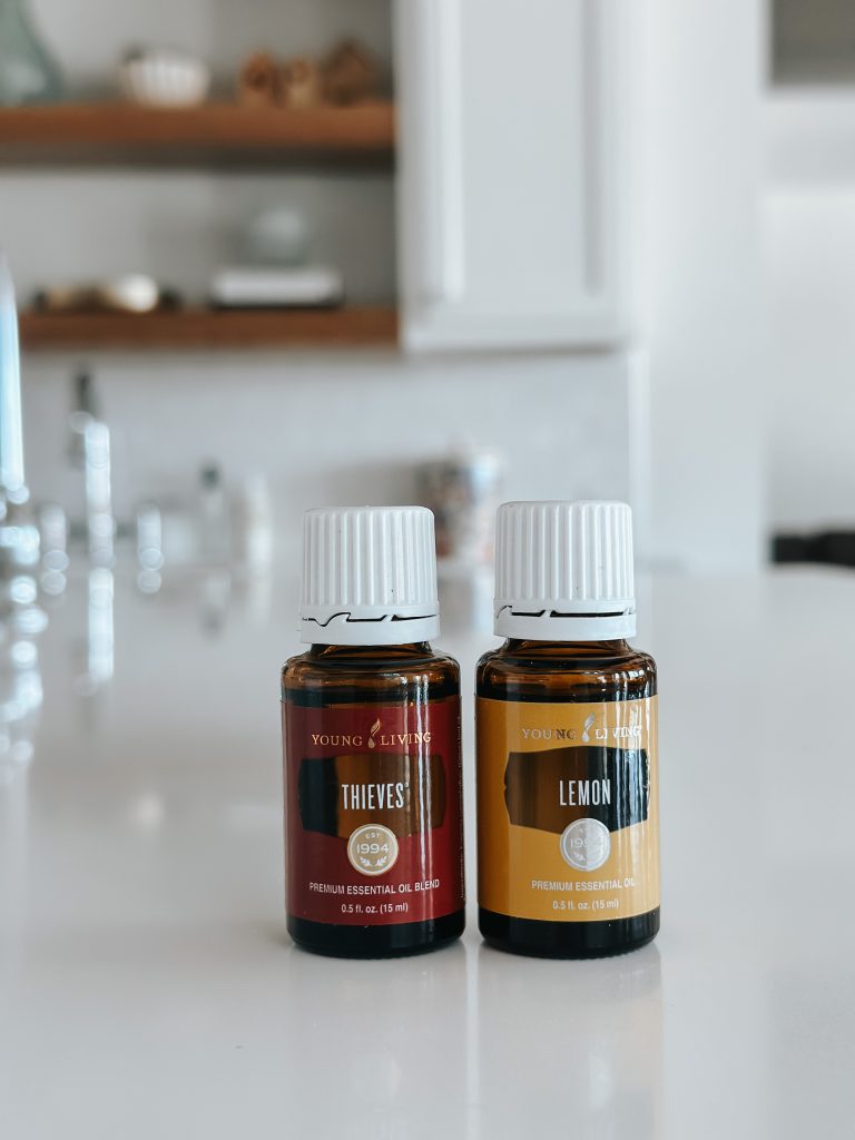 two essential oil bottles on counter