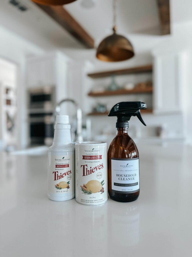 Two cleaners and a glass spray bottle on kitchen counter