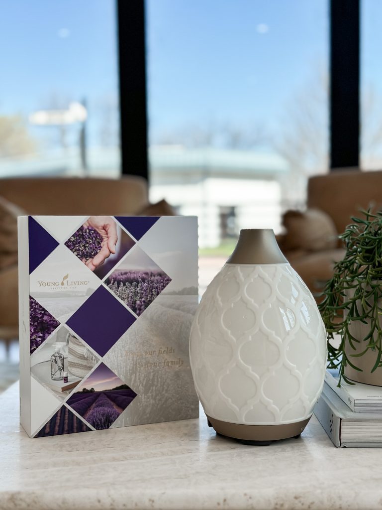 White essential oil diffuser on a table