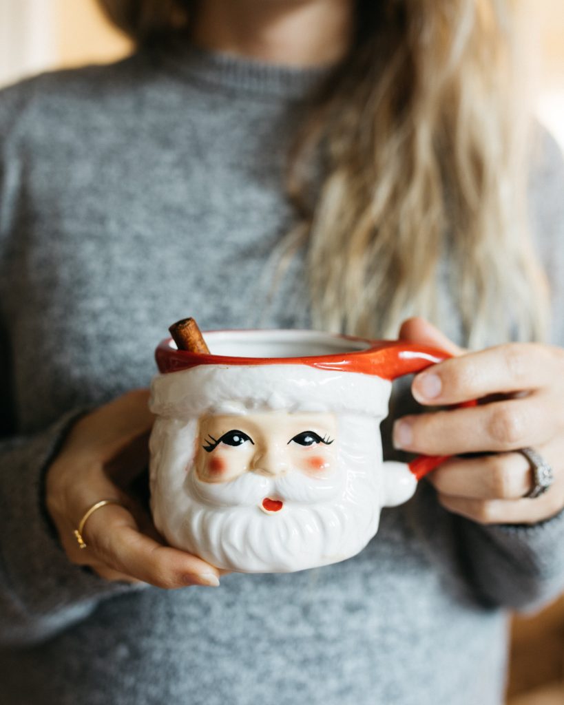 santa mug with cinnamon stick and cocoa