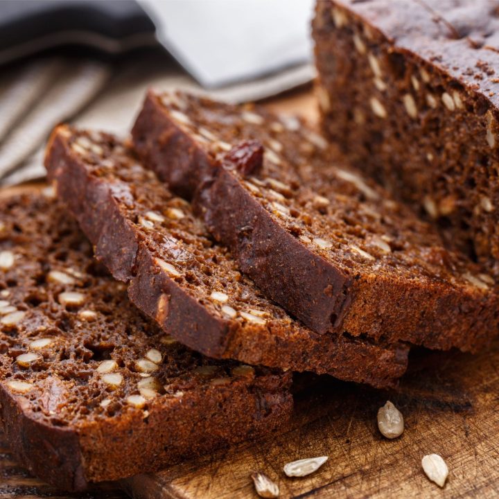 sliced pumpkin bread on a wooden cutting board