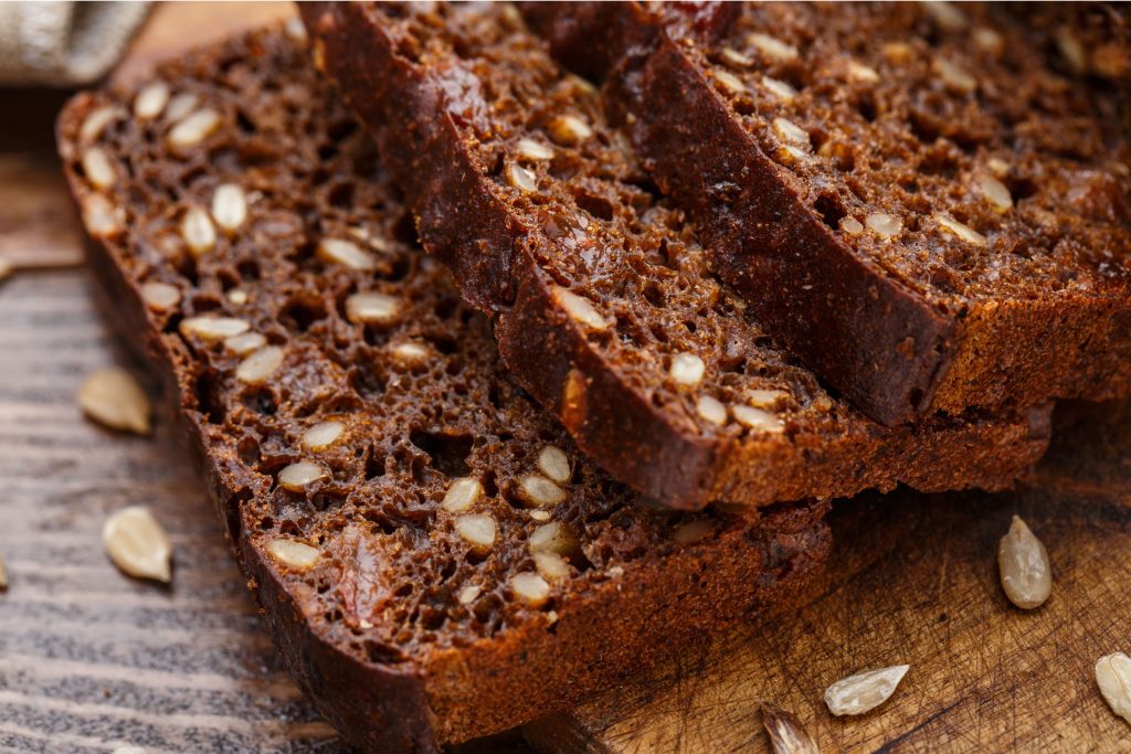 close up of pumpkin bread with nuts and seeds