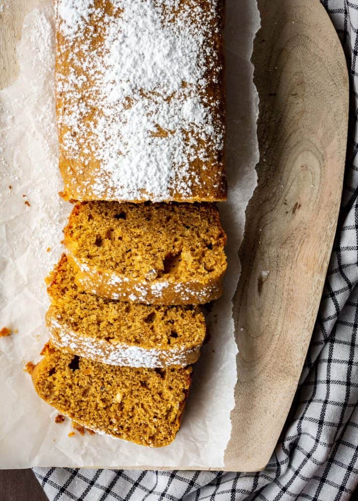 sourdough pumpkin bread sliced with powdered sugar on top