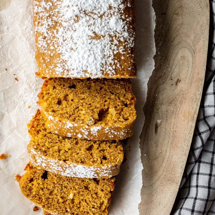 Sliced pumpkin bread with powdered sugar