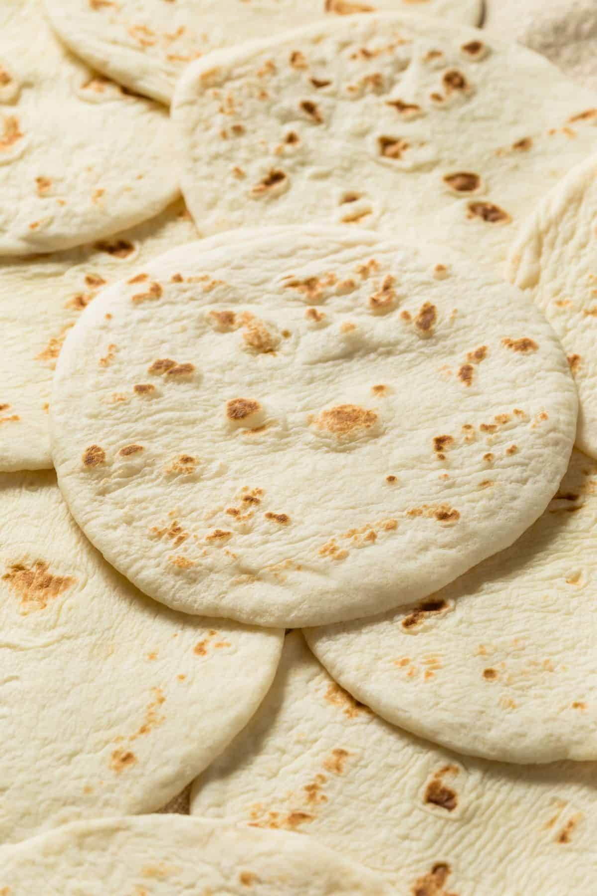 close up of soft sourdough tortillas  overlapping each other