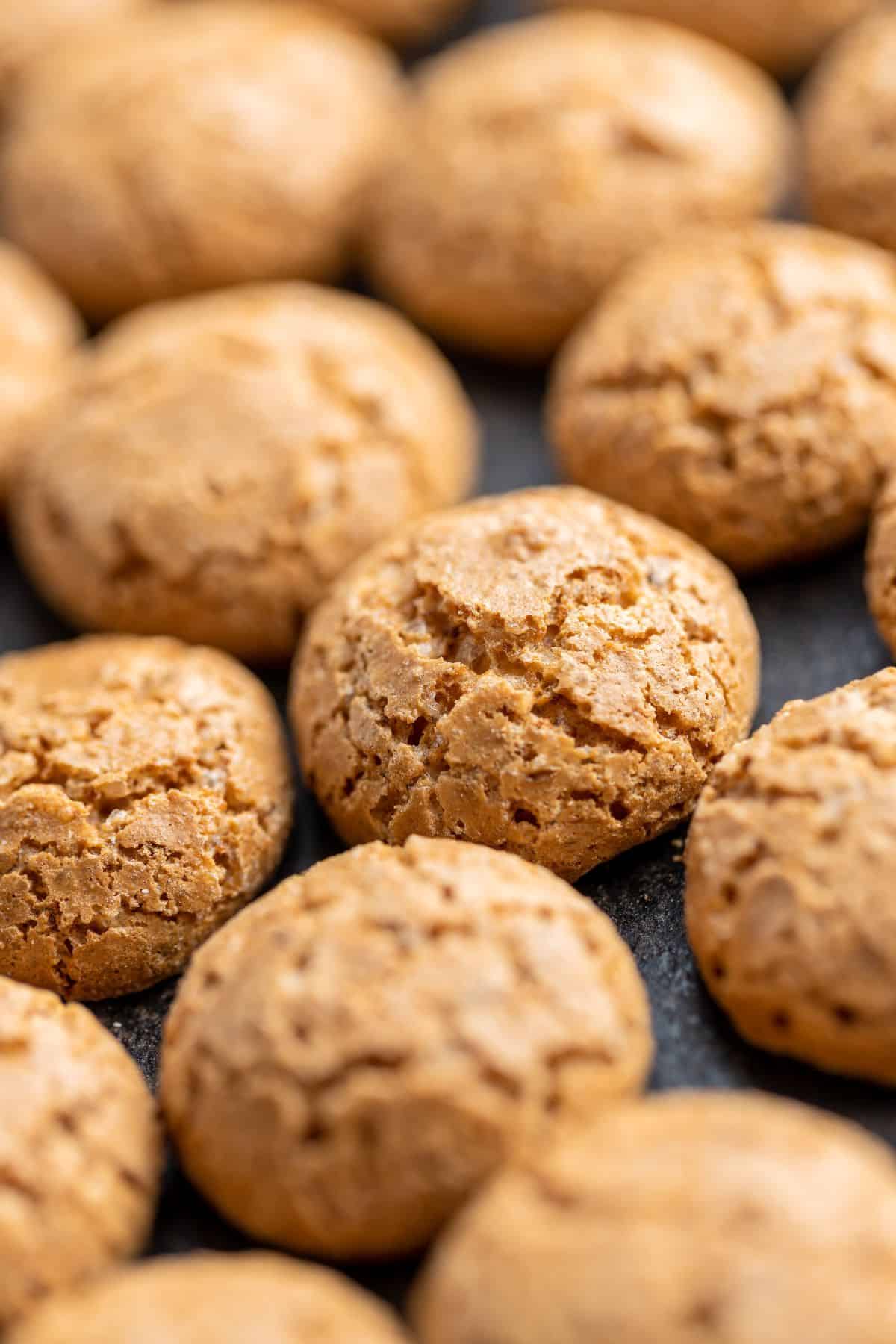 Close up of a freshly baked batch of almond sugar cookies