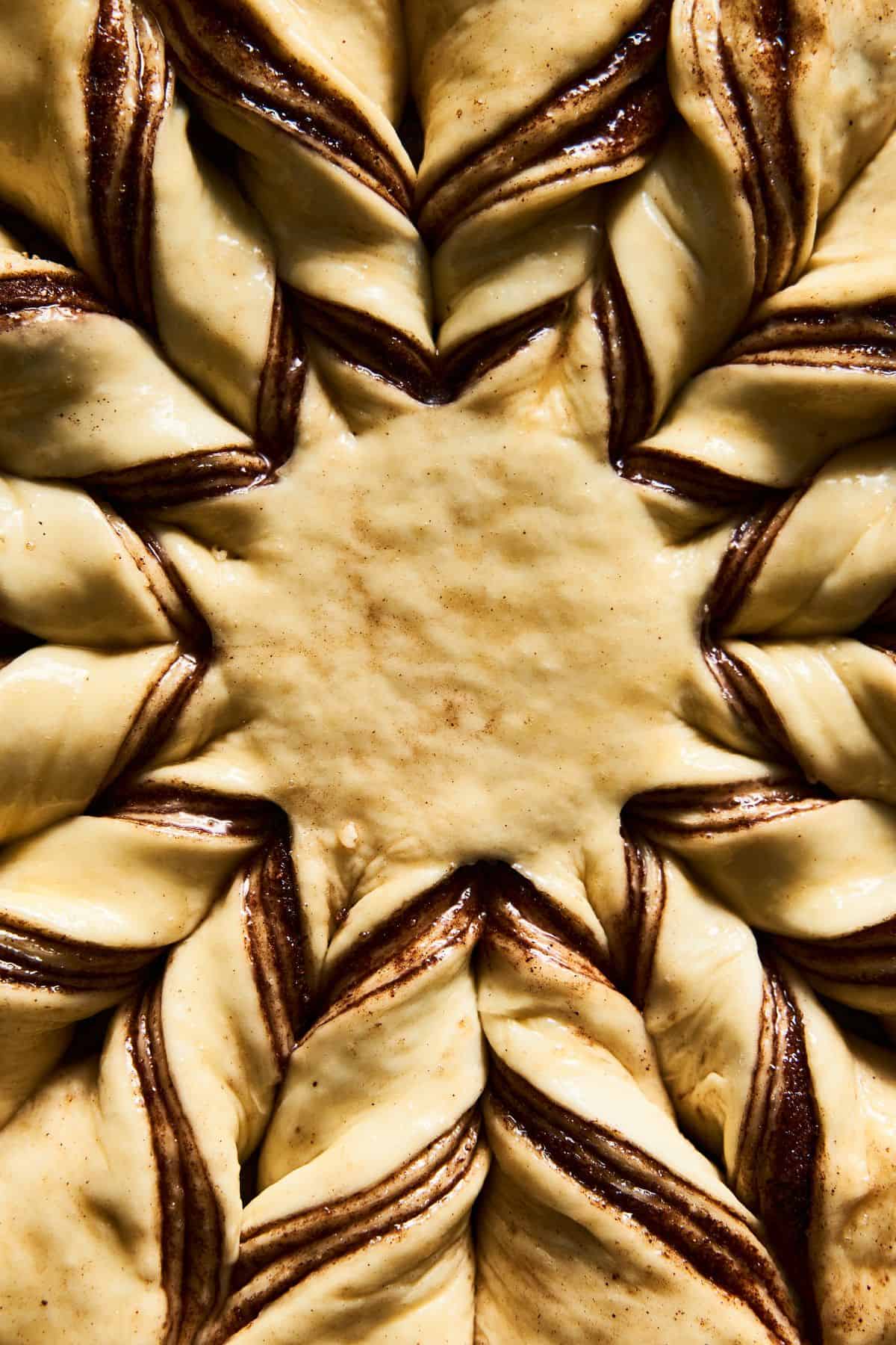 Close up of an un-baked sourdough Nutella star bread-fluffy, rich, and delicious-looking.