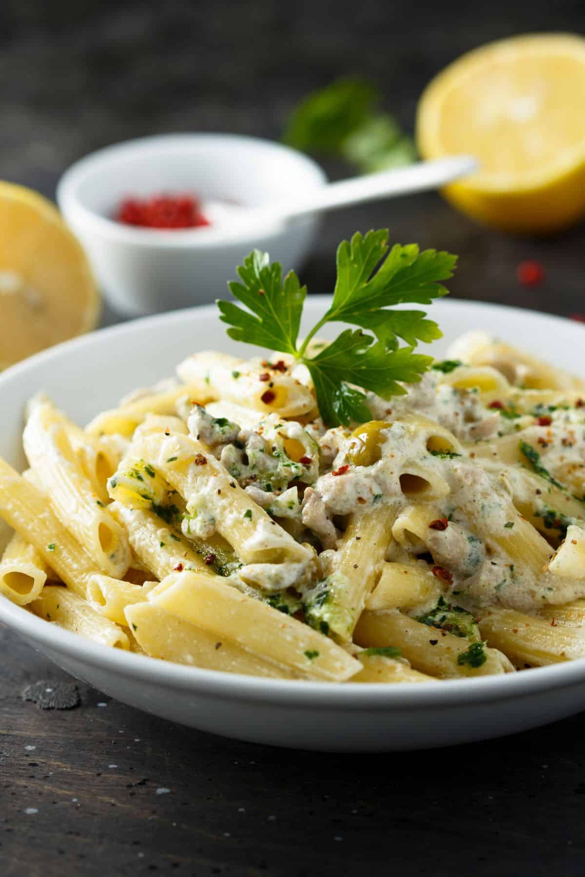 Copycat trader joe's lemon basil pasta salad recipe in a white bowl.