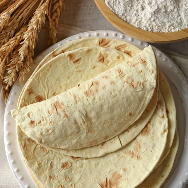 Whole grain tortillas on a white plate