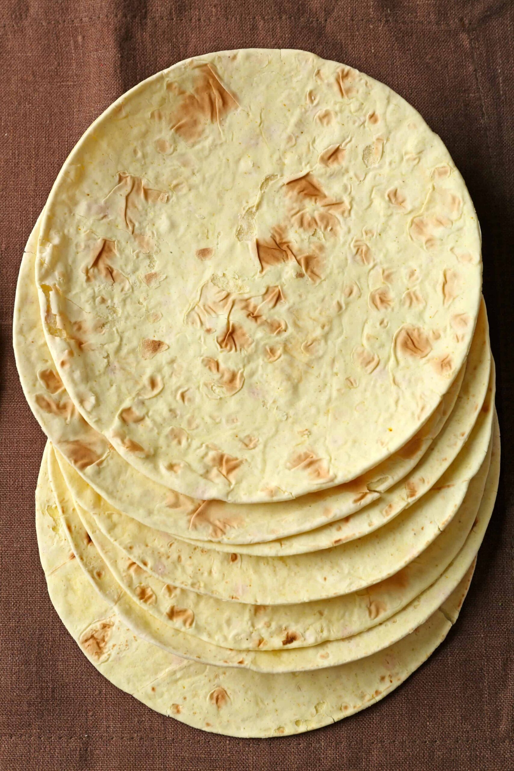 Whole grain tortillas on a linen cloth