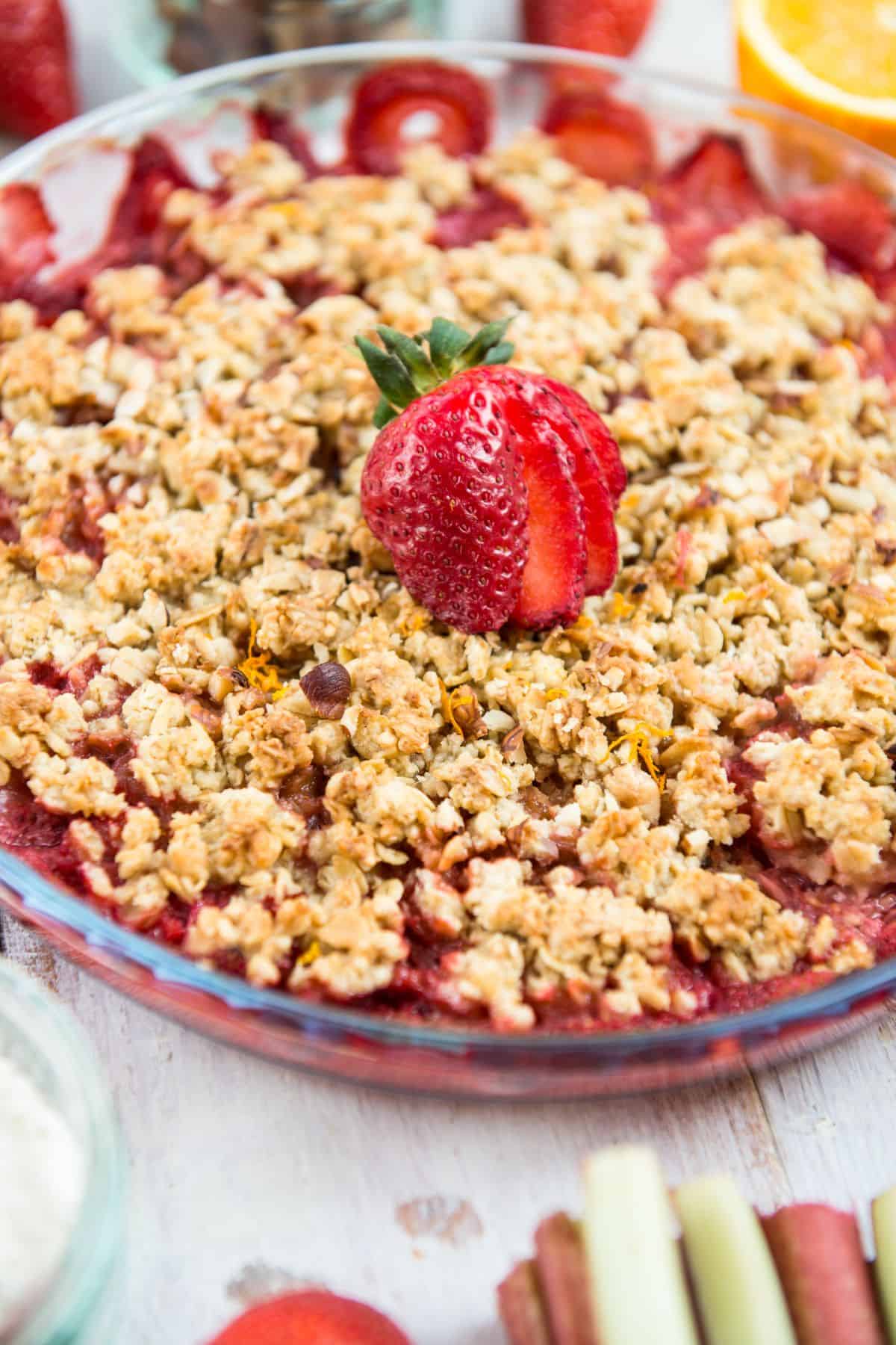 Close up of rhubarb and strawberry crisp with oats on top. 