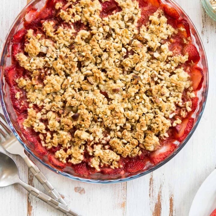 Rhubarb and strawberry crunch on a white table.