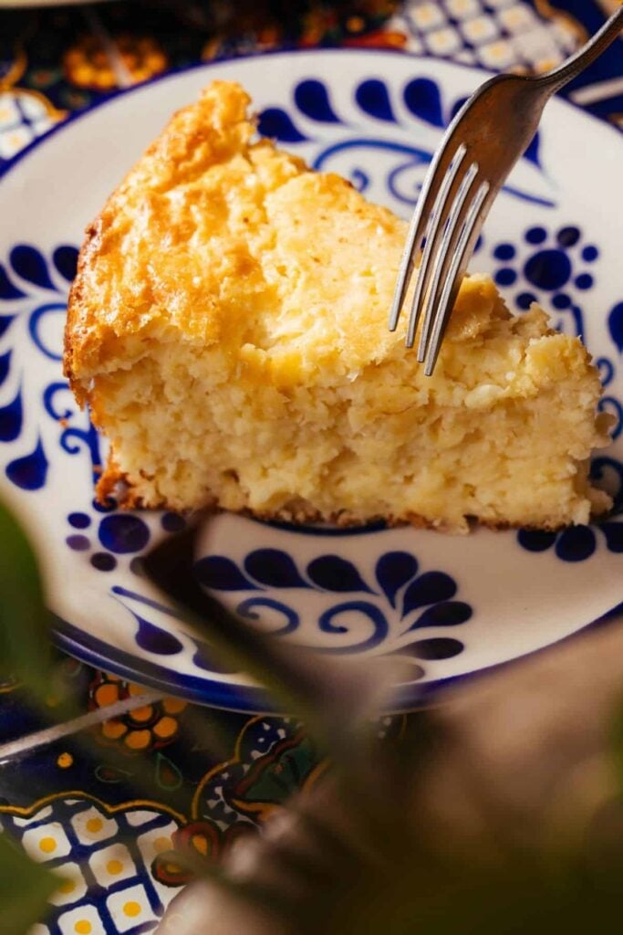 Fluffy sourdough cornbread on a blue and white plate.