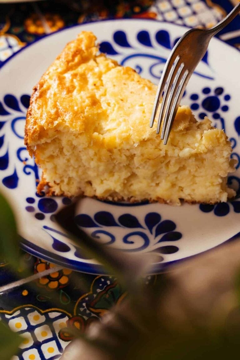 Fluffy sourdough cornbread on a blue and white plate.