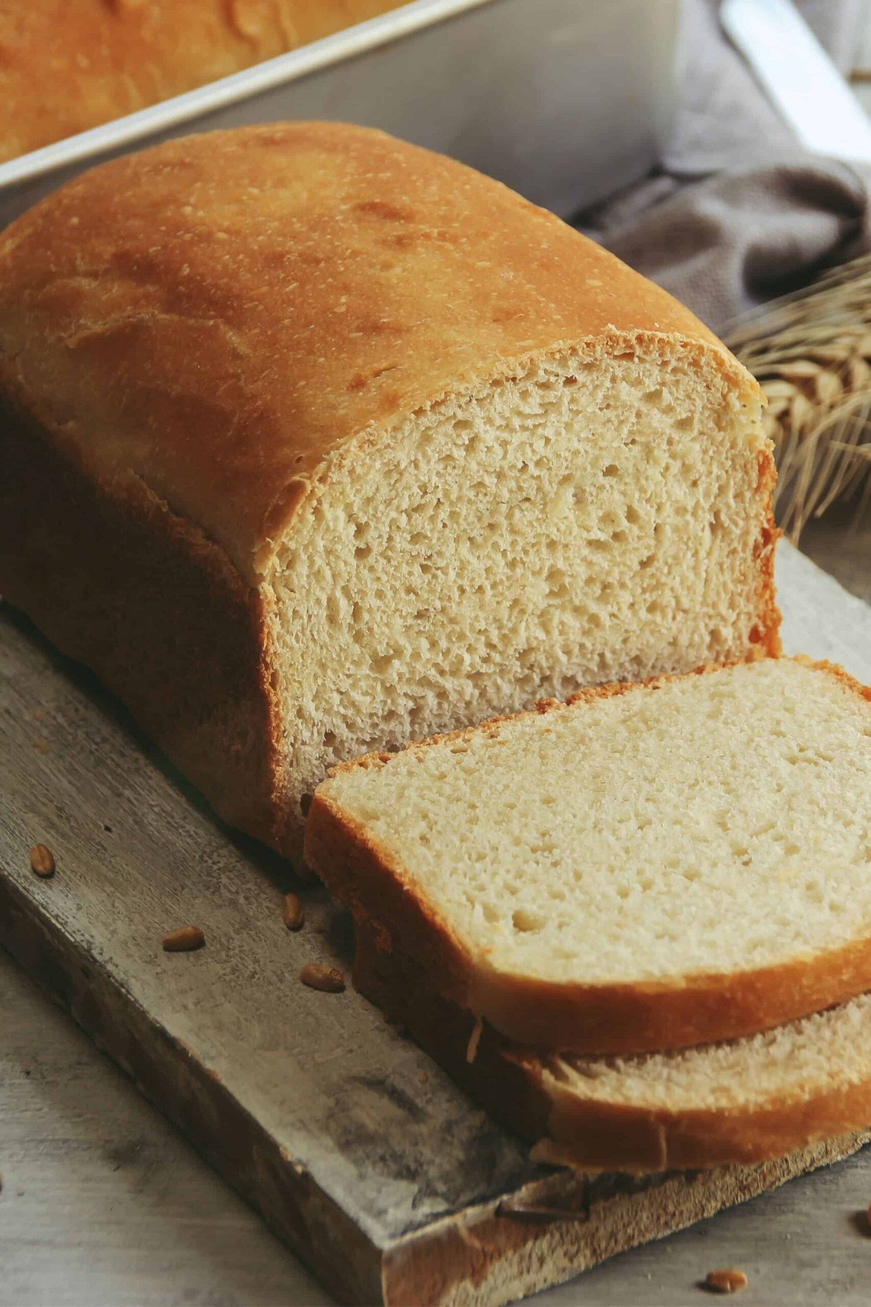 Close up of a sliced loaf of fresh milled flour bread.