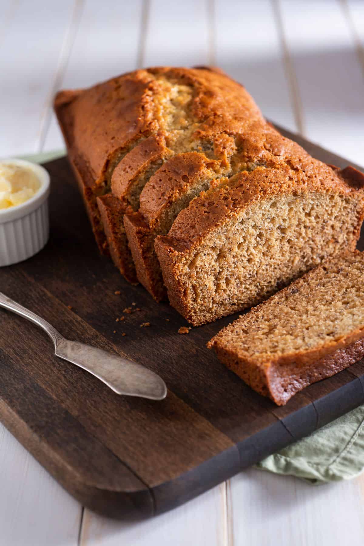close up of kodiak cakes banana bread with butter beside it