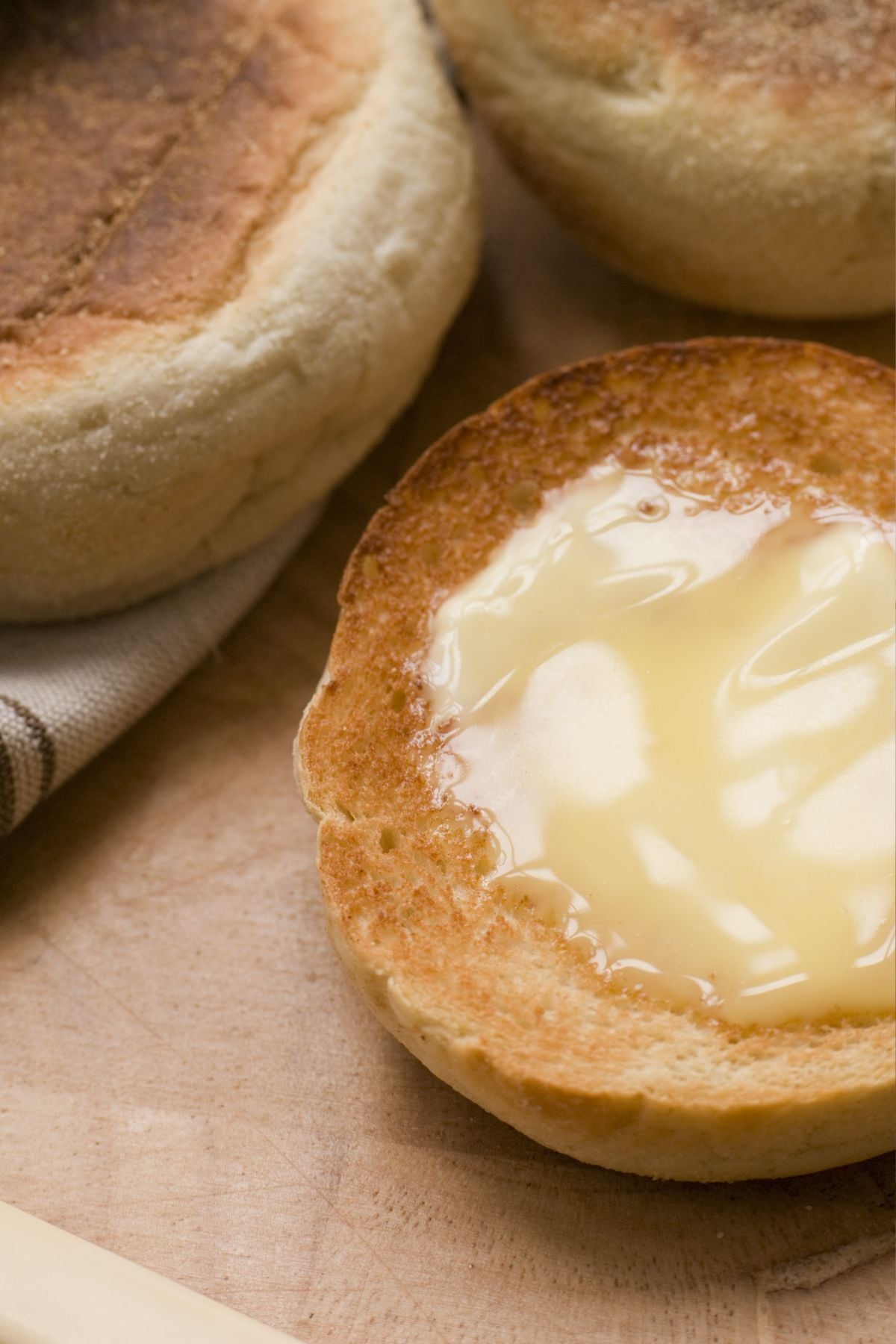Close up of fresh milled english muffin toasted with melty butter