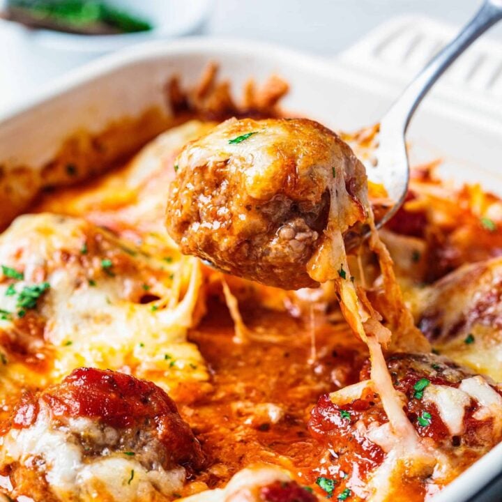 Cheesy meatball casserole being served