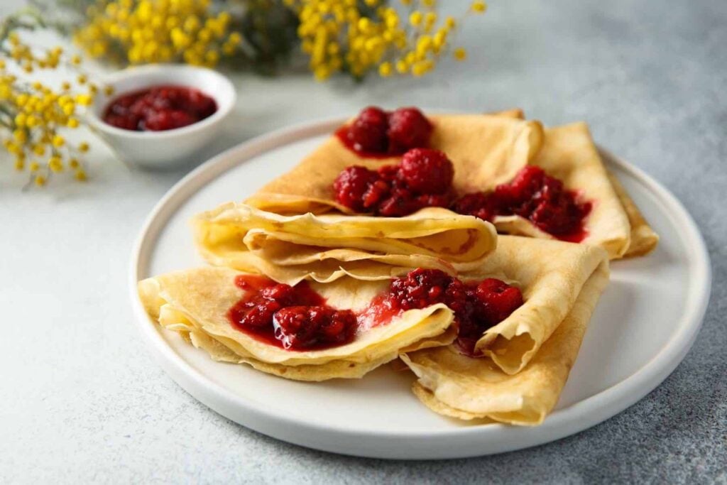 Fluffy sourdough crepe recipe with raspberry jam