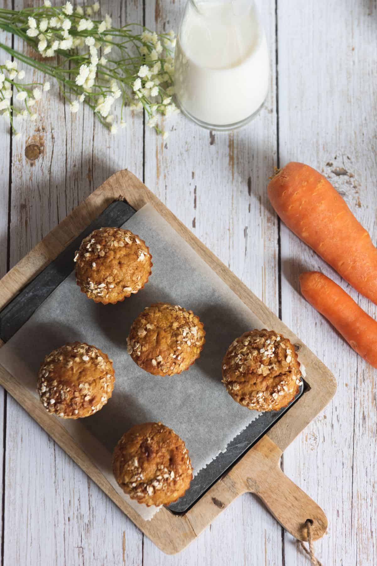 Whole wheat carrot zucchini muffins with carrots and milk
